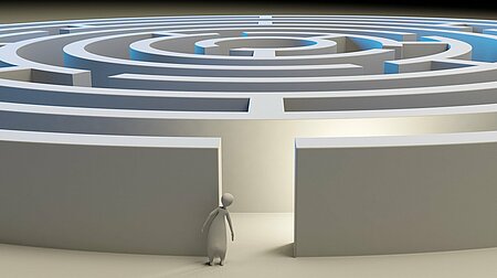 Die Grafik zeigt einen zögerlichen und orientierungslosen Avatar vor einem Labyrinth