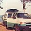 A camper van in front of the sea side