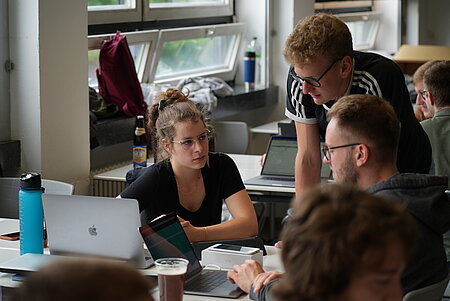 Students discuss their project at the Usability Day.