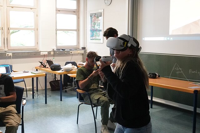 Students testing an VR headset.