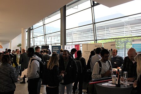 International students and companies talking on campus at TH Rosenheim.