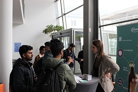 International students and companies talking on campus at TH Rosenheim.