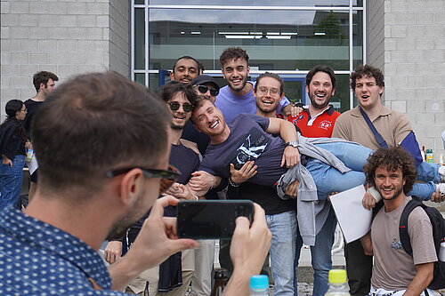 Students taking a photo at the closing ceremony.